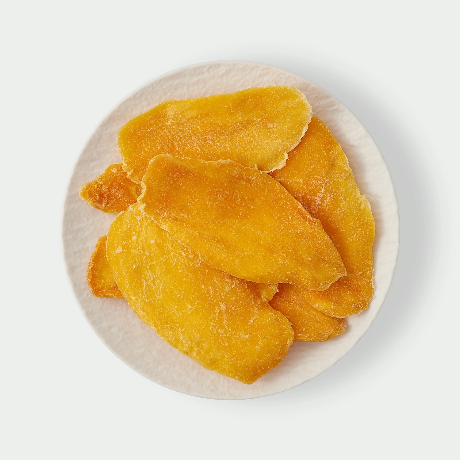 Dried mango slices on a plate